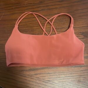 XS vuori Sports Bra in a terracotta color